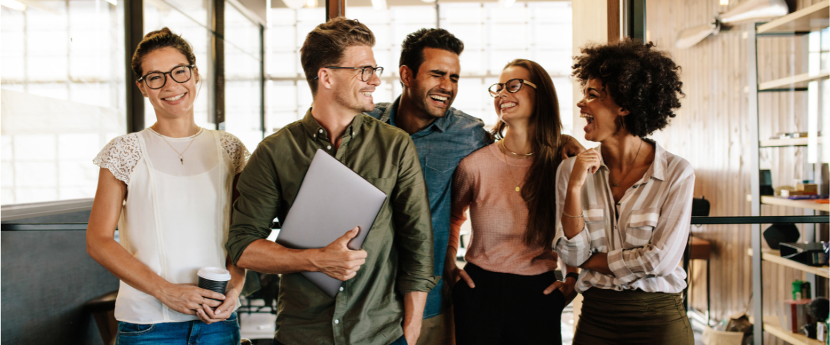 Happy employees in a. UK business with effective employment and HR policies